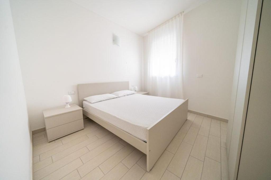 Postel nebo postele na pokoji v ubytování Sabbia & Mare