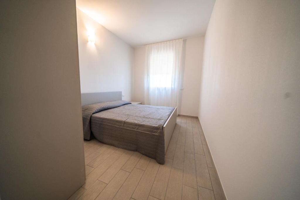 Postel nebo postele na pokoji v ubytování Sabbia & Mare