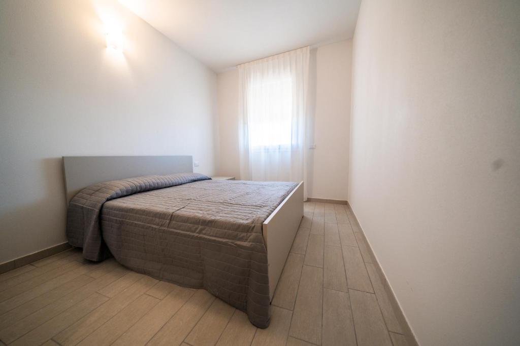 Postel nebo postele na pokoji v ubytování Sabbia & Mare