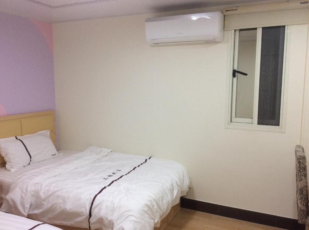 Postel nebo postele na pokoji v ubytování Li Jie Coffee Homestay
