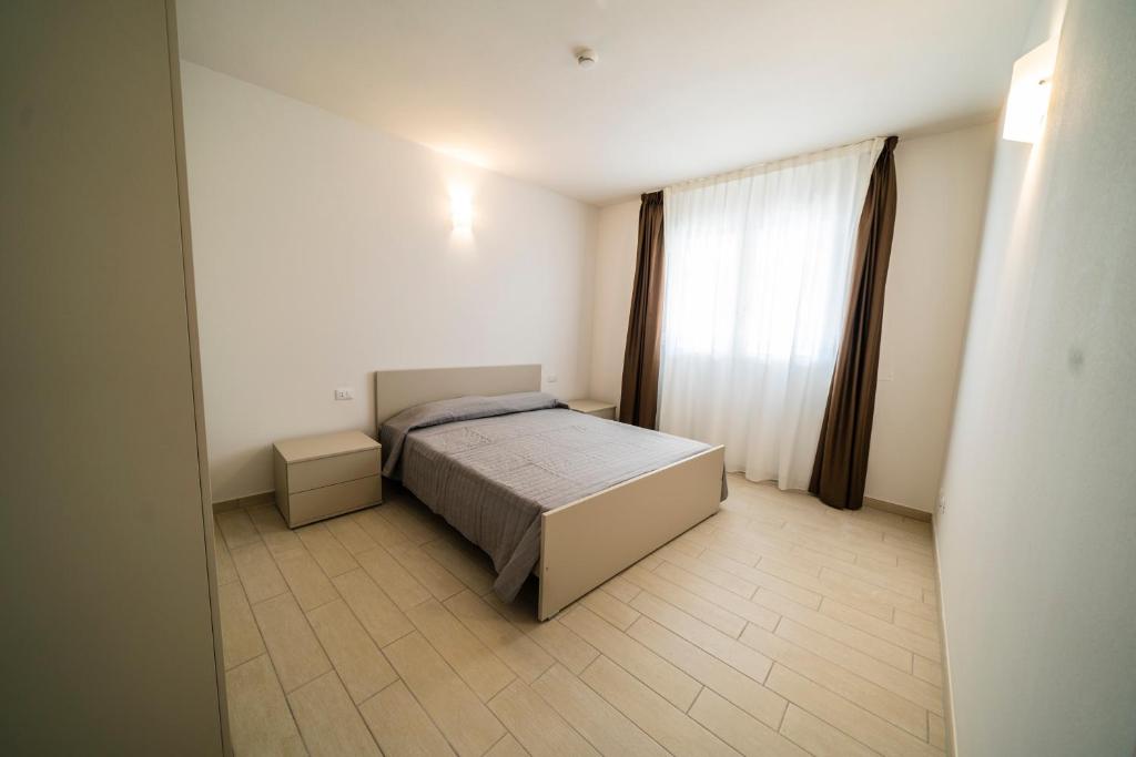Postel nebo postele na pokoji v ubytování Sabbia & Mare