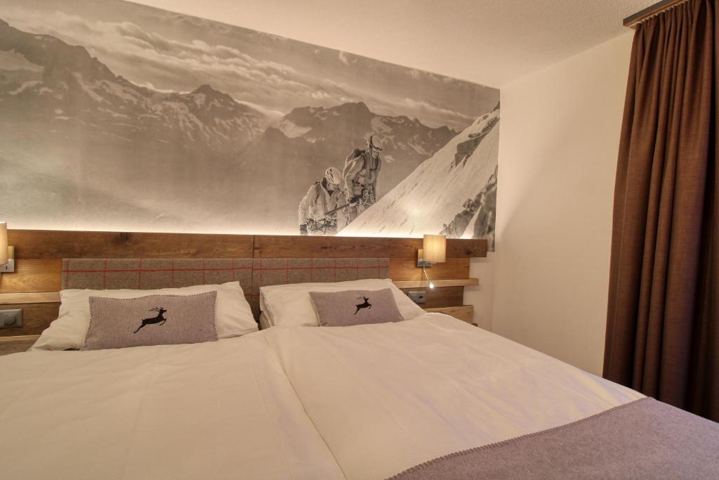 Postel nebo postele na pokoji v ubytování Matterhorngruss Apartments