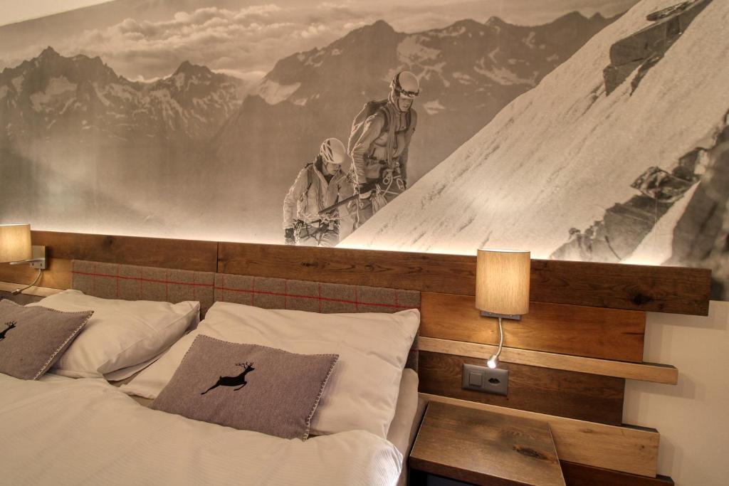 Postel nebo postele na pokoji v ubytování Matterhorngruss Apartments