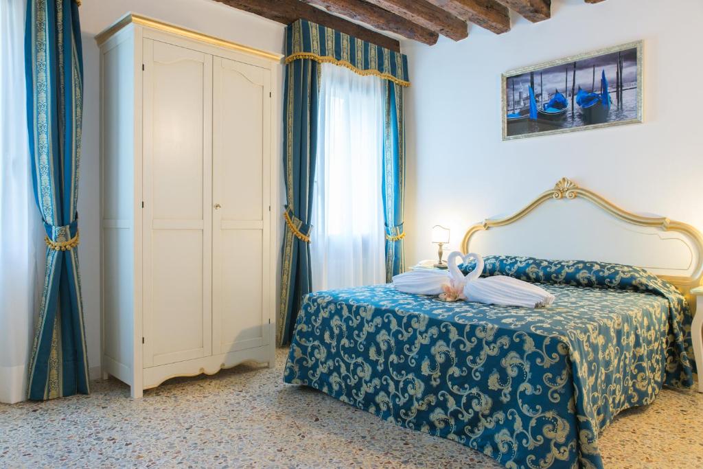 Cama ou camas em um quarto em Al Mascaron Ridente