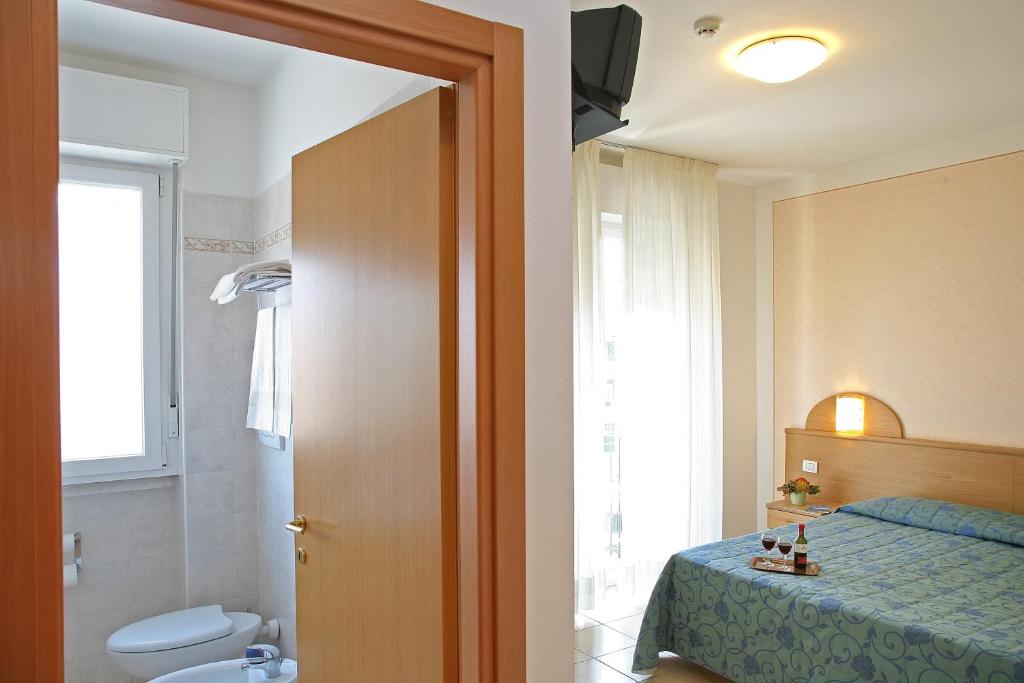 Postel nebo postele na pokoji v ubytování Hotel Marina