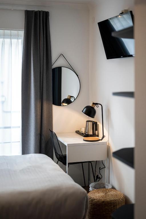 Postel nebo postele na pokoji v ubytování Beverly Hills Hotel