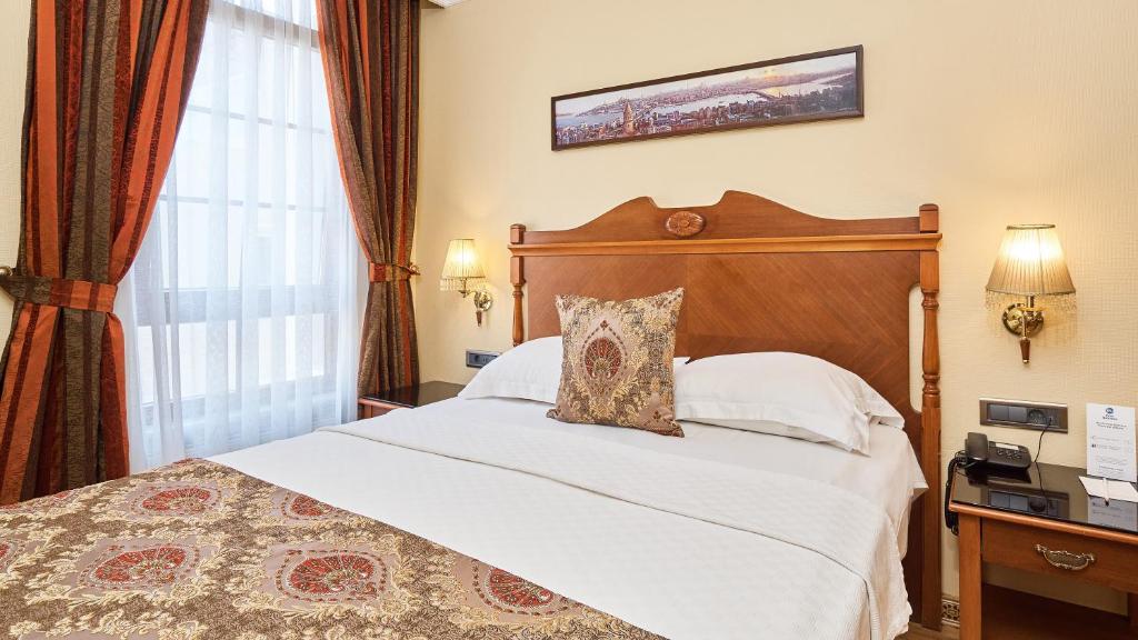 A bed or beds in a room at Best Western Empire Palace Hotel & Spa