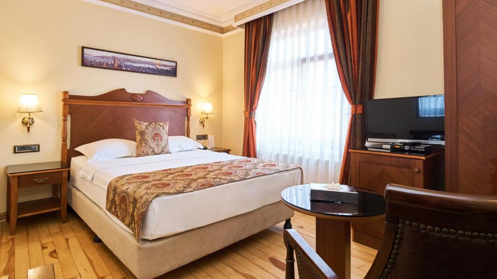 A bed or beds in a room at Best Western Empire Palace Hotel & Spa