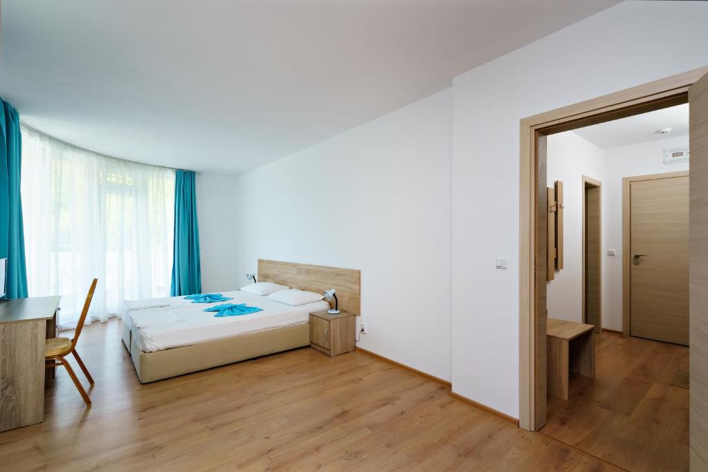 Postel nebo postele na pokoji v ubytování Hotel Elitza