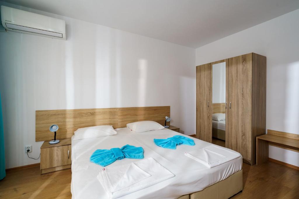 Postel nebo postele na pokoji v ubytování Hotel Elitza