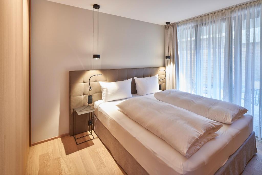 Postel nebo postele na pokoji v ubytování Hotel Misan