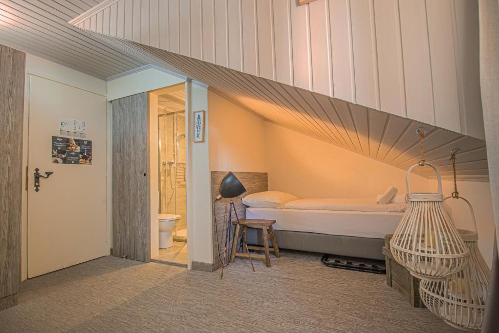 Postel nebo postele na pokoji v ubytování Seven Boutique Hotel