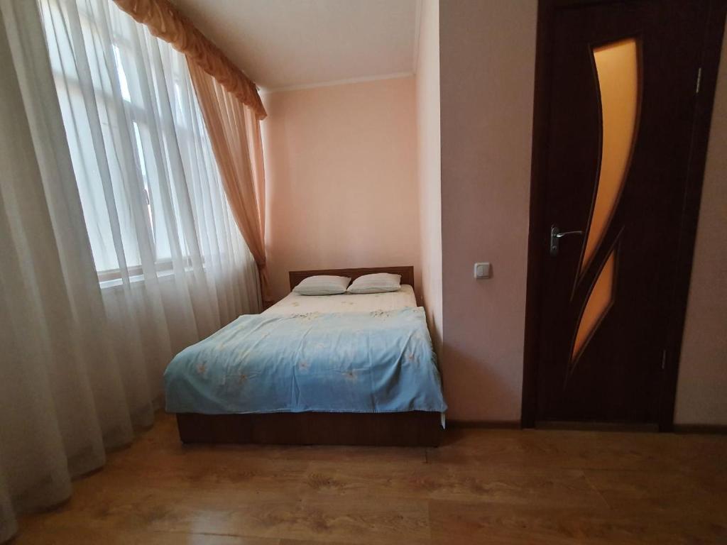 Postel nebo postele na pokoji v ubytování Мотель Карман