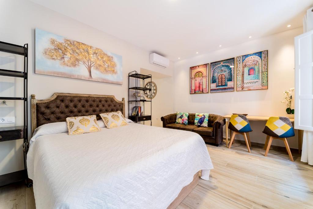 En eller flere senge i et værelse på Suite Capitán 3