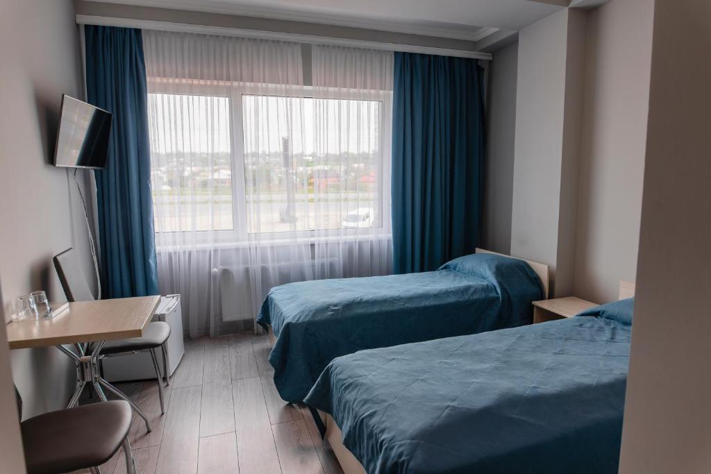 Ein Bett oder Betten in einem Zimmer der Unterkunft AF TRANS Hotel