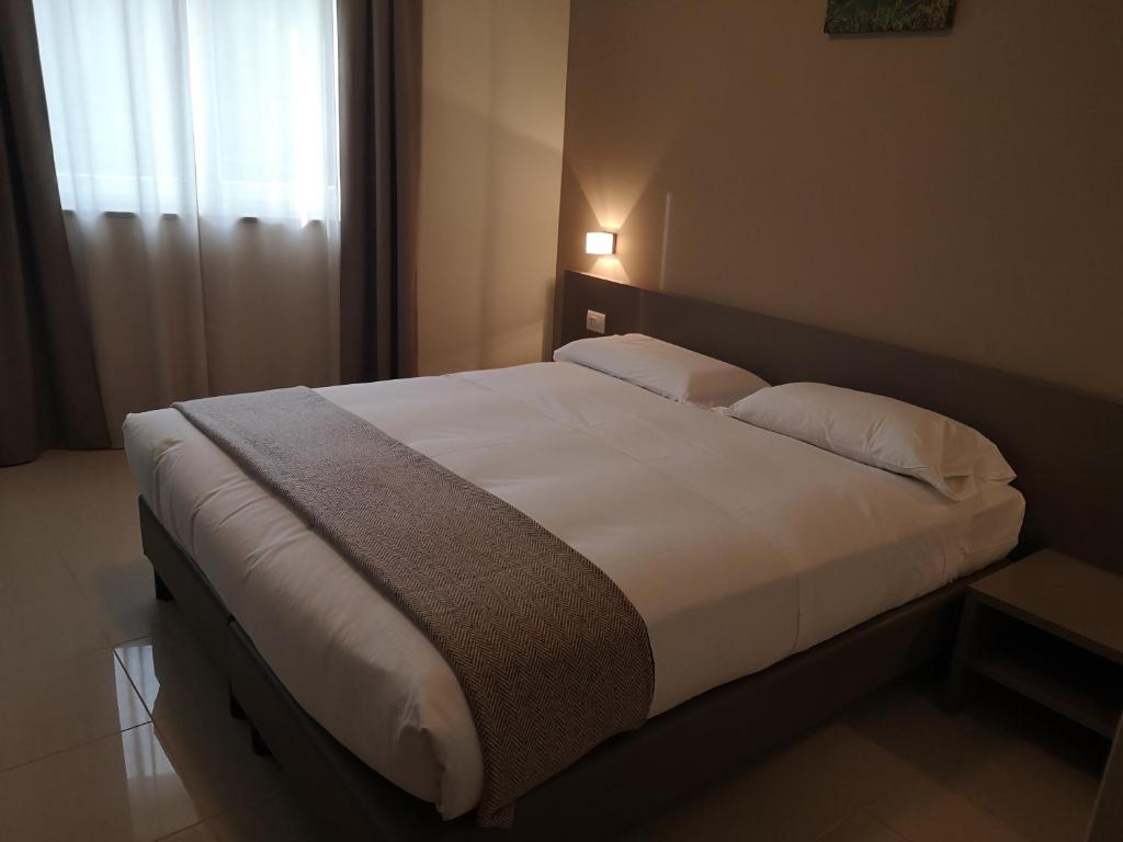Posteľ alebo postele v izbe v ubytovaní Hotel & Wellness Stella Delle Langhe