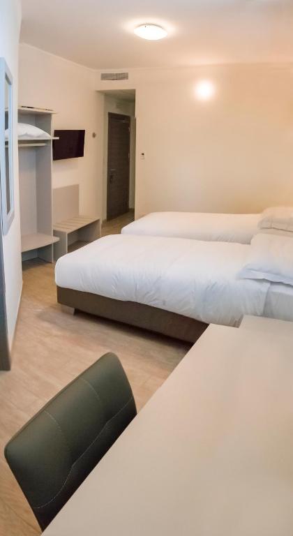 Posteľ alebo postele v izbe v ubytovaní Hotel & Wellness Stella Delle Langhe