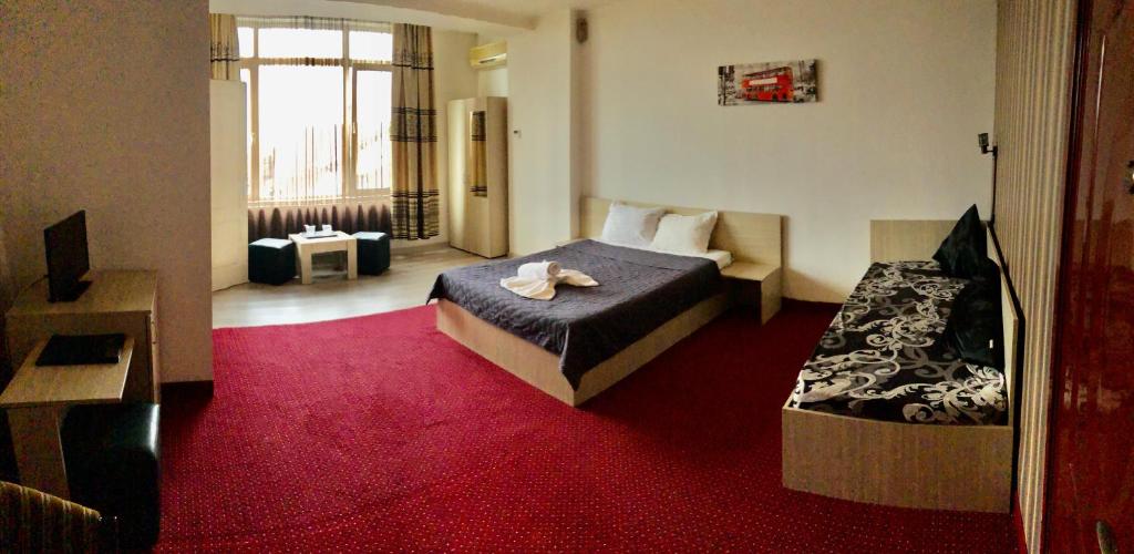 Postel nebo postele na pokoji v ubytování Hotel Mon Caprice
