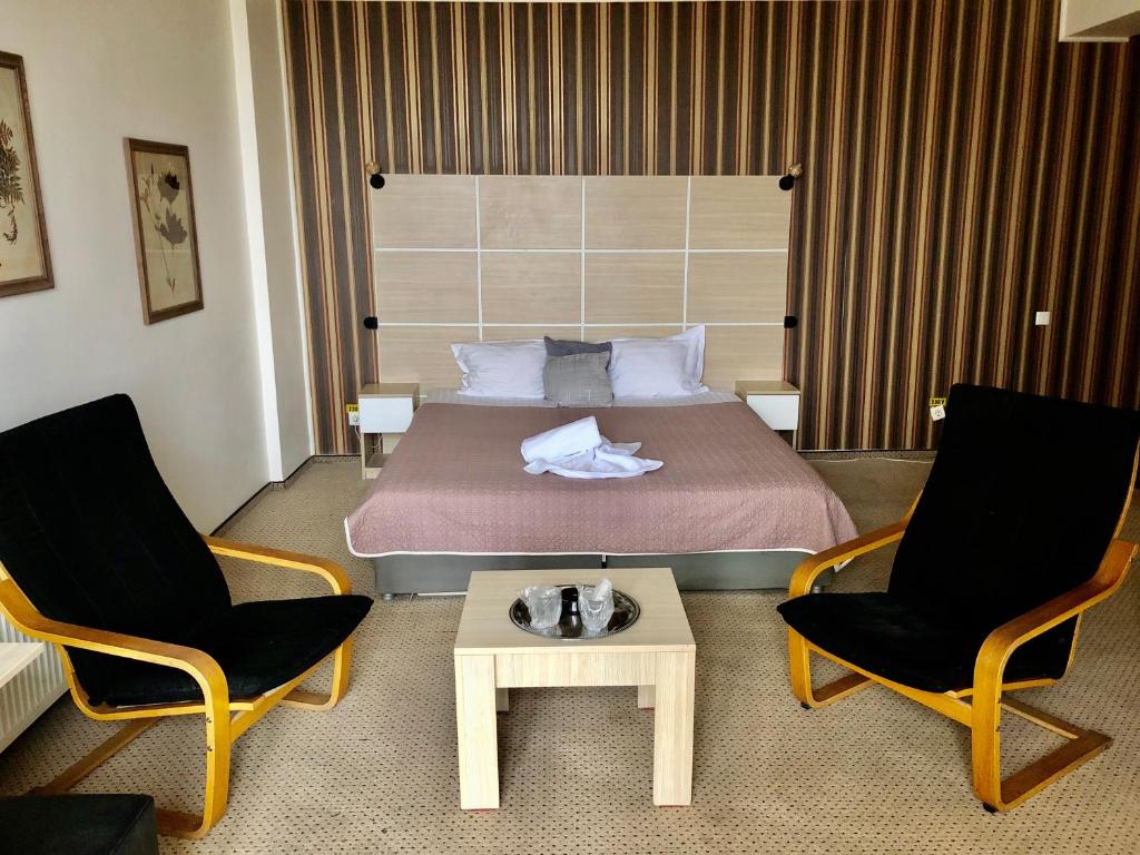 Postel nebo postele na pokoji v ubytování Hotel Mon Caprice