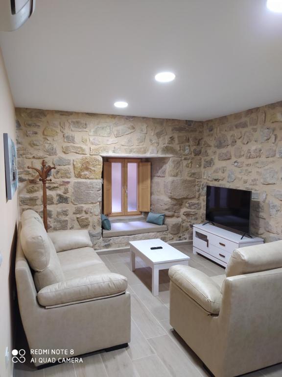 TV a/nebo společenská místnost v ubytování Apartamentos Alameda