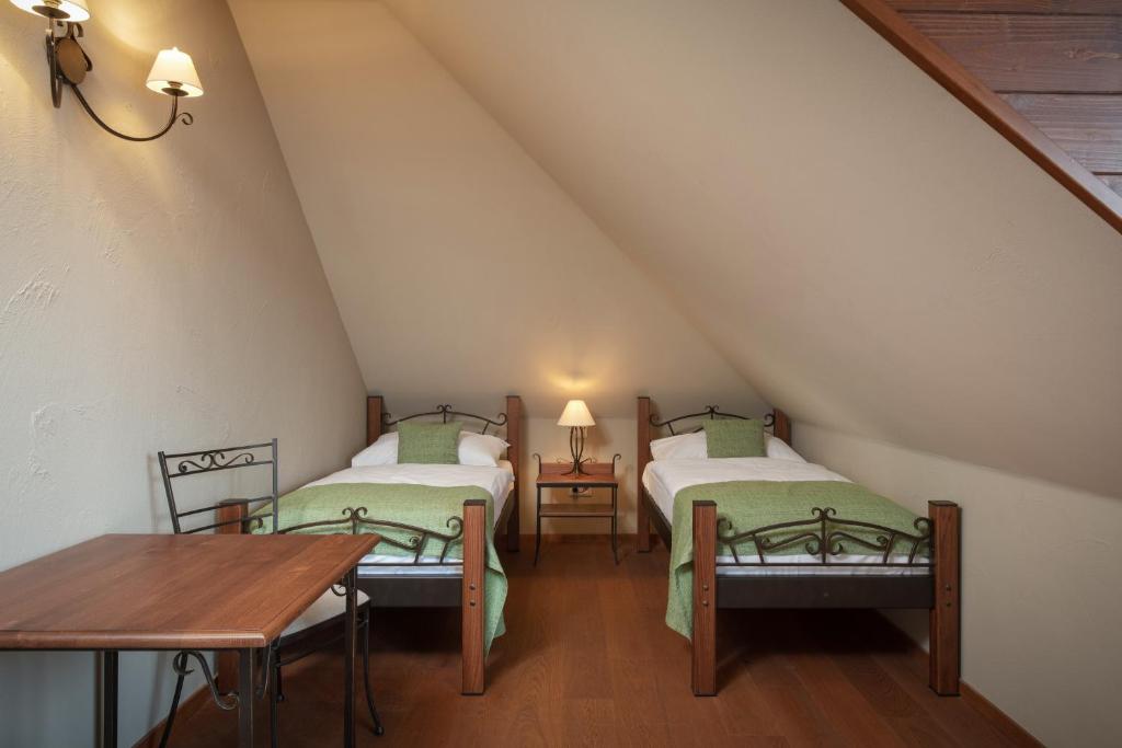 Postel nebo postele na pokoji v ubytování Resort Sobotín