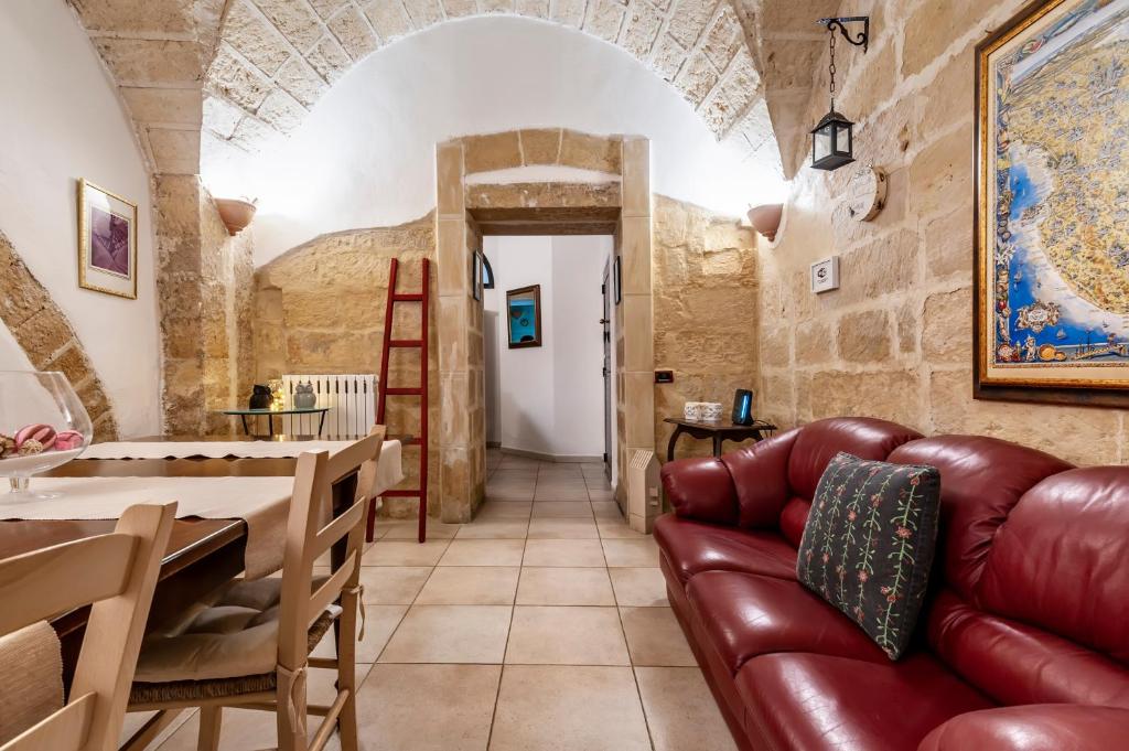 a living room with a couch and a table at B&B Antiche Volte in Lecce