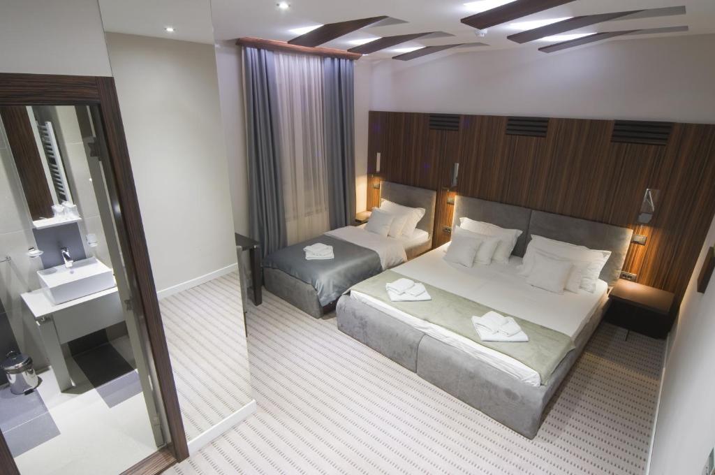 Postel nebo postele na pokoji v ubytování Hotel Viva