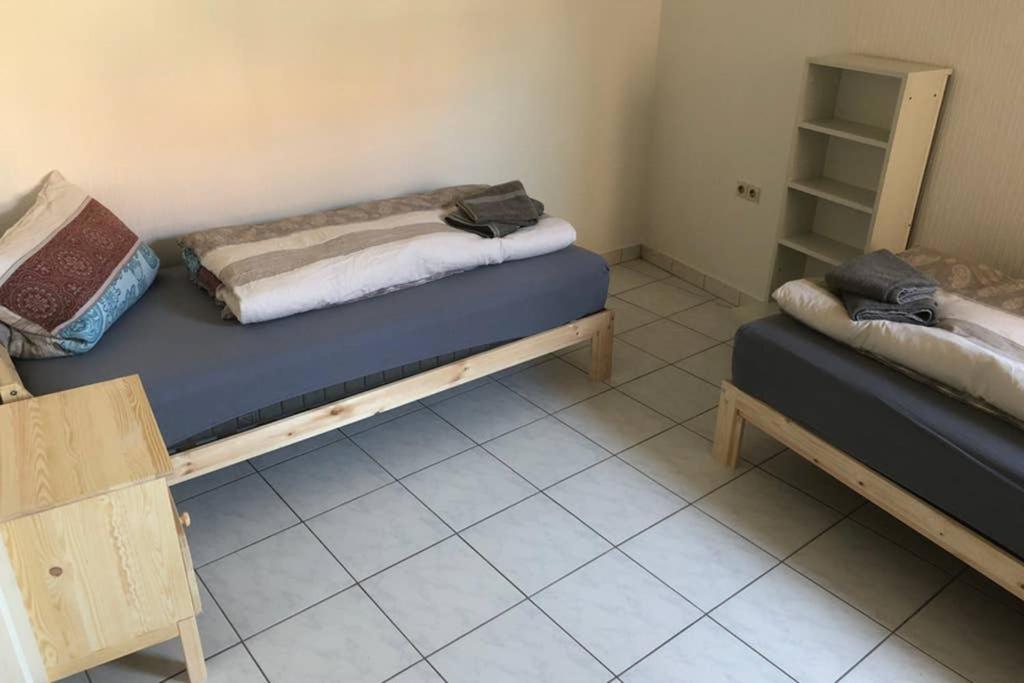 a bedroom with two beds in a room at room for four in Alzenau in Unterfranken