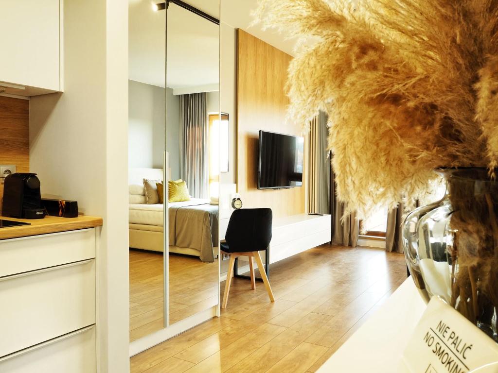 Televízia a/alebo spoločenská miestnosť v ubytovaní LM Ventus Apartment