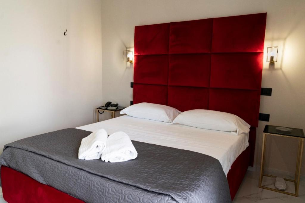 Postel nebo postele na pokoji v ubytování Hotel Elite