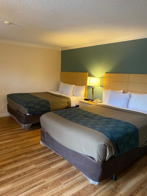 Voodi või voodid majutusasutuse Econo Lodge at the Falls North toas