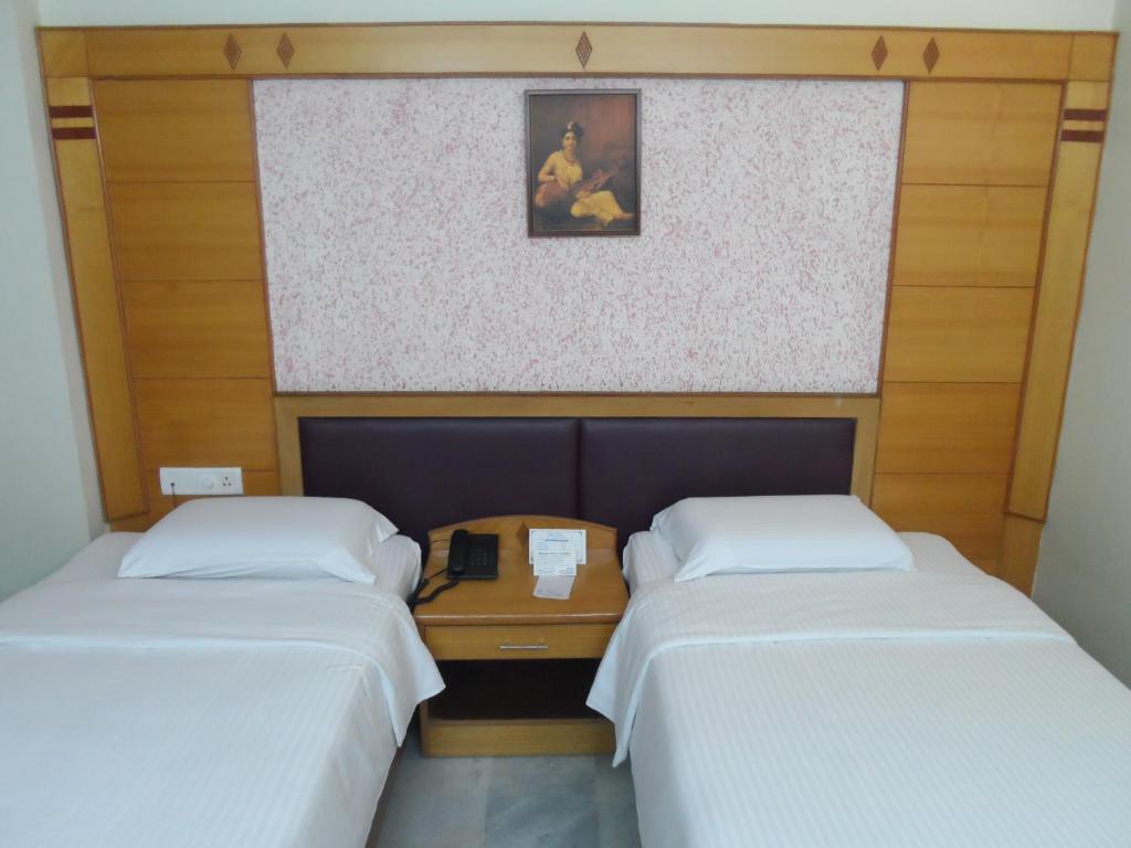 Postel nebo postele na pokoji v ubytování Hotel PLR Grand