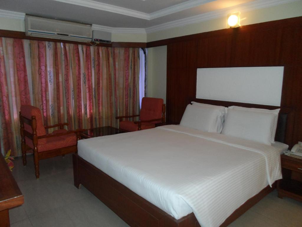 Postel nebo postele na pokoji v ubytování Hotel PLR Grand