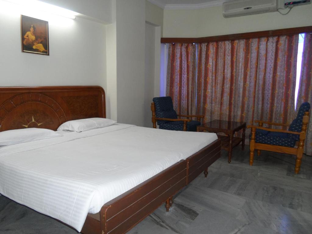 Postel nebo postele na pokoji v ubytování Hotel PLR Grand