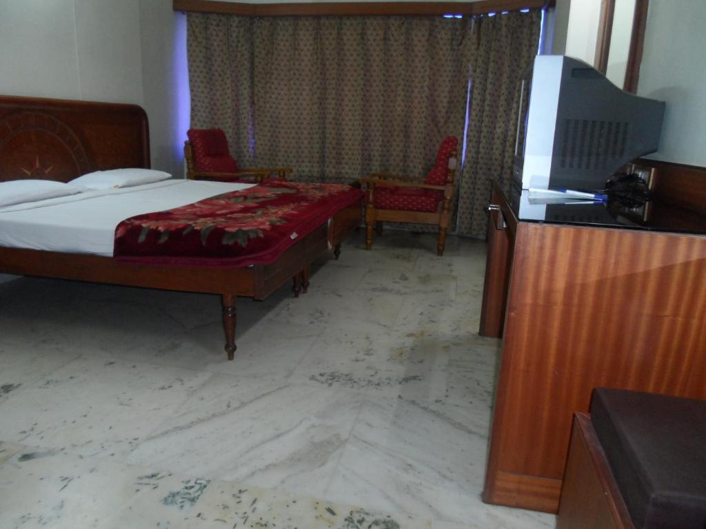 Postel nebo postele na pokoji v ubytování Hotel PLR Grand