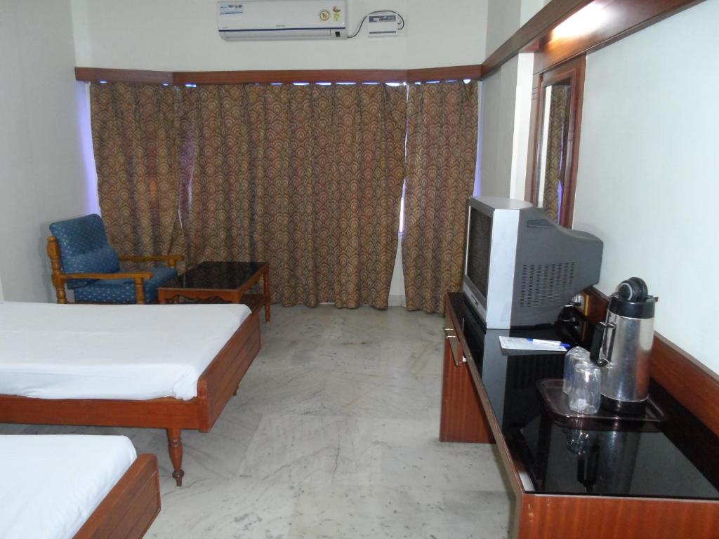 Postel nebo postele na pokoji v ubytování Hotel PLR Grand