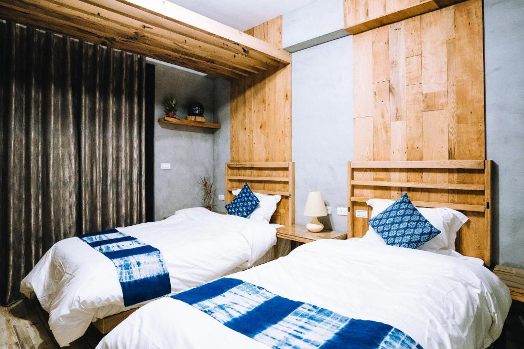 Postel nebo postele na pokoji v ubytování 似禾苑民宿 Siheyuan Homestay