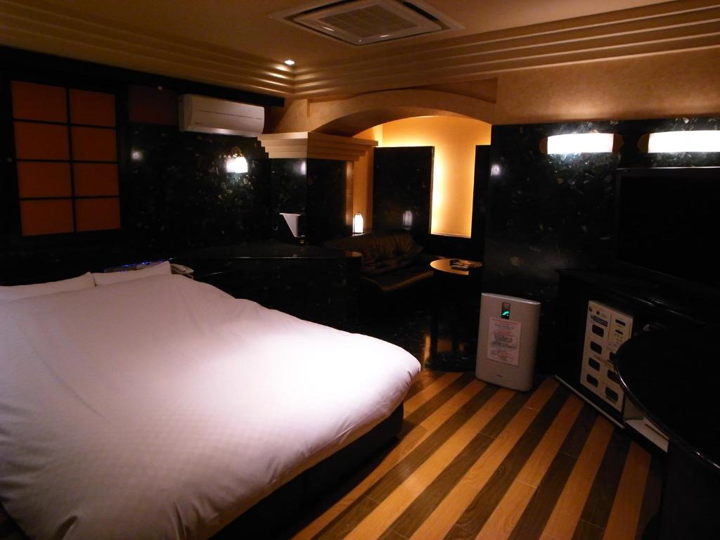 Postel nebo postele na pokoji v ubytování HOTEL K VILLAGE