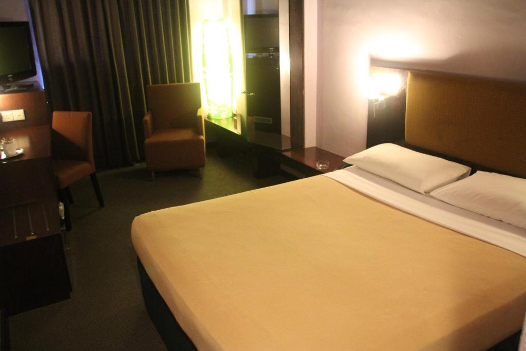 Postel nebo postele na pokoji v ubytování Strand Hotel