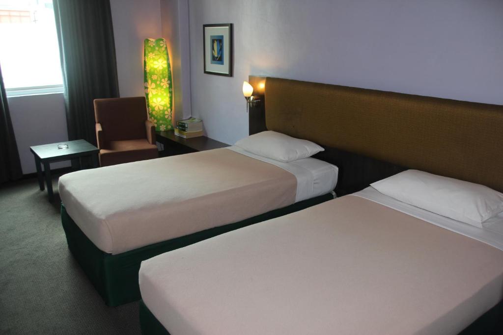 Postel nebo postele na pokoji v ubytování Strand Hotel