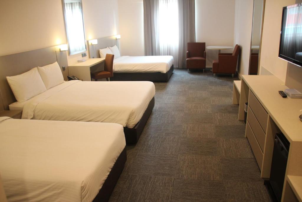 TV a/nebo společenská místnost v ubytování Strand Hotel
