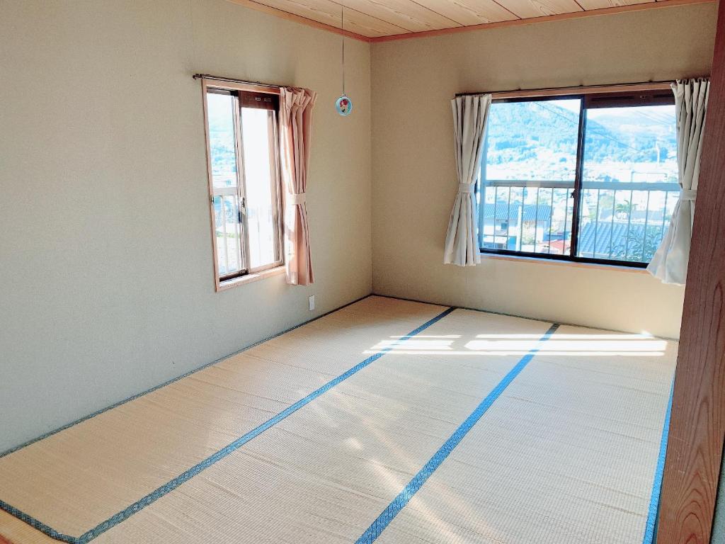 Letto o letti in una camera di Yufuin Sunday