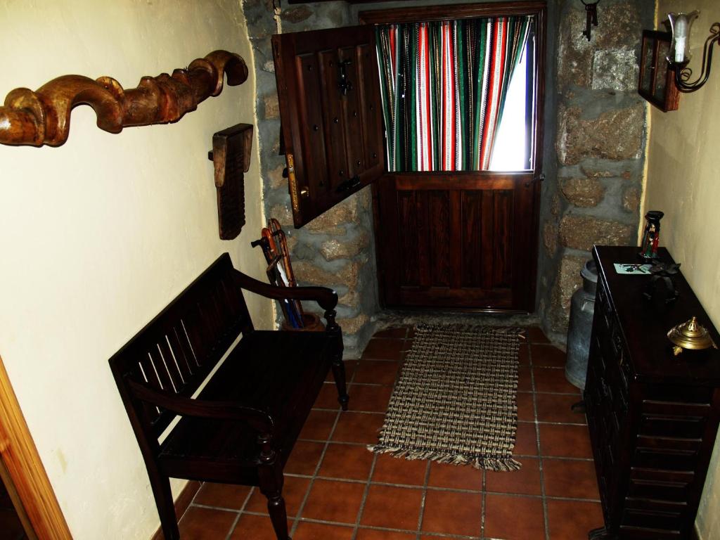 a room with a door and a chair and a window at Gemerendura in Blacha