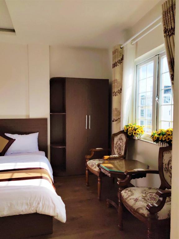 Giường trong phòng chung tại New Hampton Suits-Tam Xuan Centre Hotel