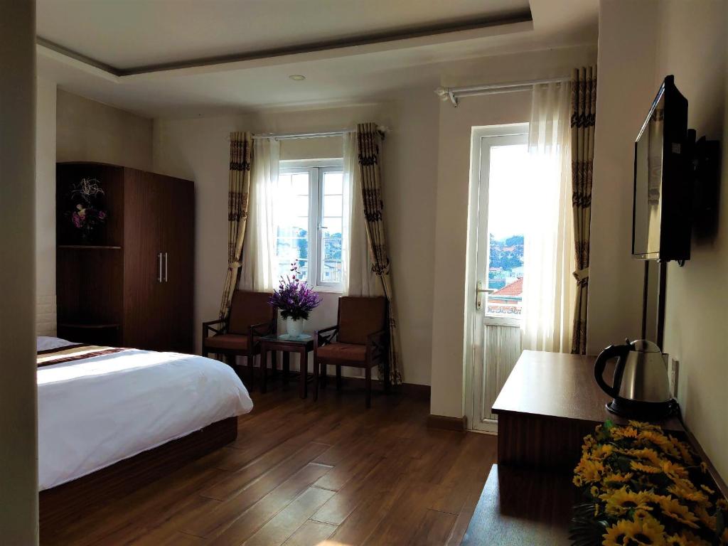 TV/trung tâm giải trí tại New Hampton Suits-Tam Xuan Centre Hotel