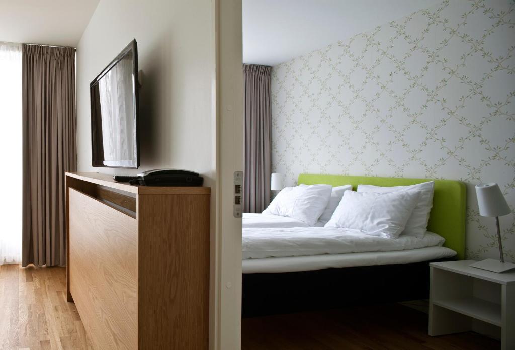 Postel nebo postele na pokoji v ubytování Thon Hotel Sandven