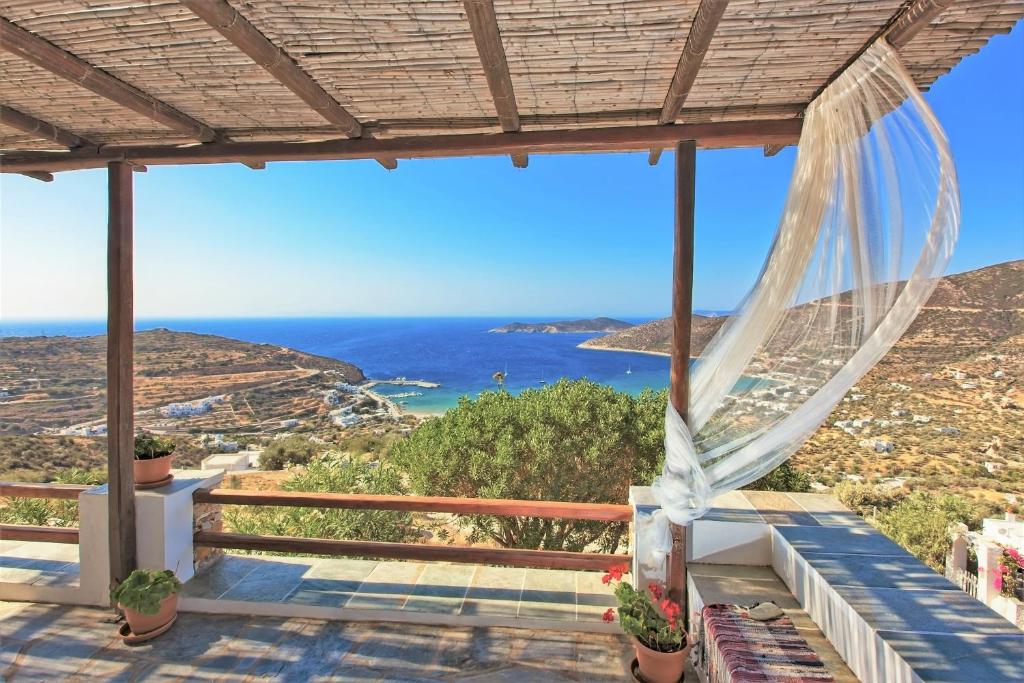 a view of the ocean from the porch of a house at Sifnos Residence in Platis Gialos