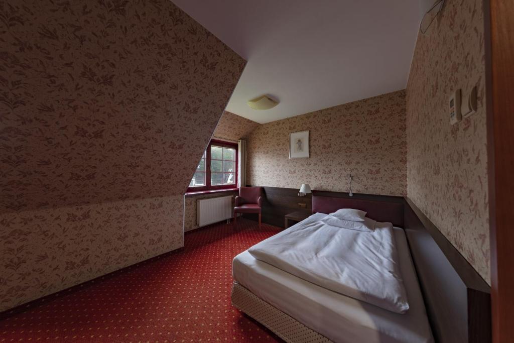 Postel nebo postele na pokoji v ubytování Hotel 1231