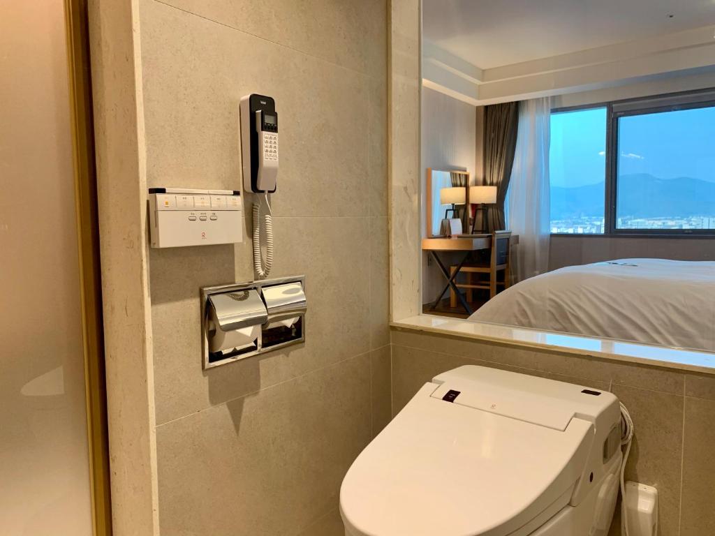 Postel nebo postele na pokoji v ubytování Hotel Interburgo Daegu