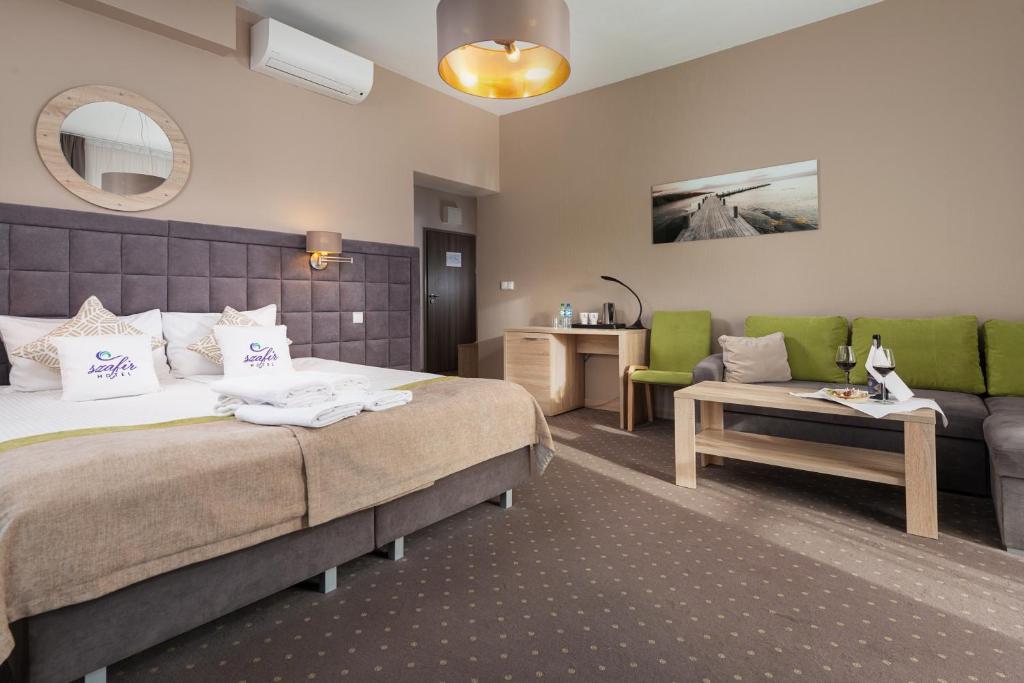 Postel nebo postele na pokoji v ubytování Hotel Szafir
